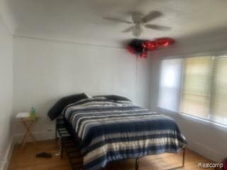 19131 Cliff St, Detroit, MI 48234 - bedroom featuring baseboards and a ceiling fan