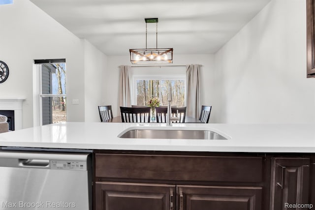 2799 Gallop Way, Saline, MI 48176 - kitchen with stainless steel dishwasher, dark brown cabinets, light countertops, and plenty of natural light