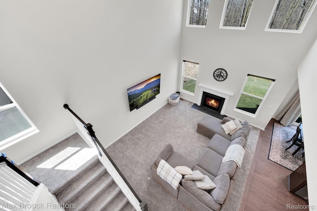 2799 Gallop Way, Saline, MI 48176 - living room featuring a fireplace with flush hearth and a high ceiling