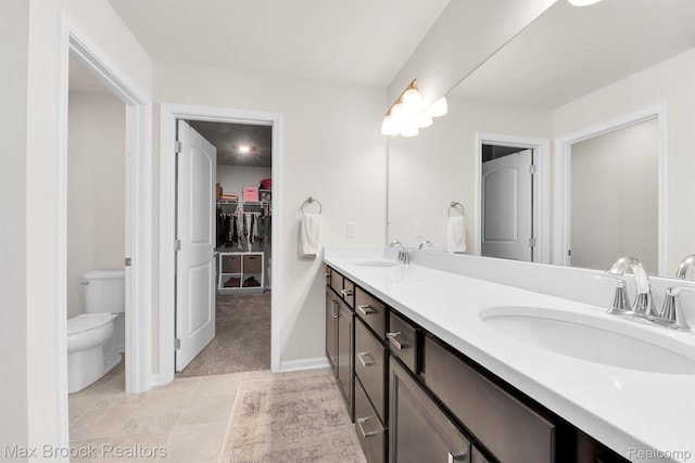 2799 Gallop Way, Saline, MI 48176 - full bathroom with double vanity, a walk in closet, and tile patterned floors