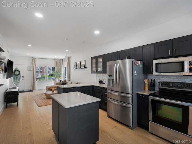 2147 Princeton Rd, Berkley, MI 48072 - kitchen with appliances with stainless steel finishes, dark cabinetry, light countertops, decorative backsplash, and recessed lighting