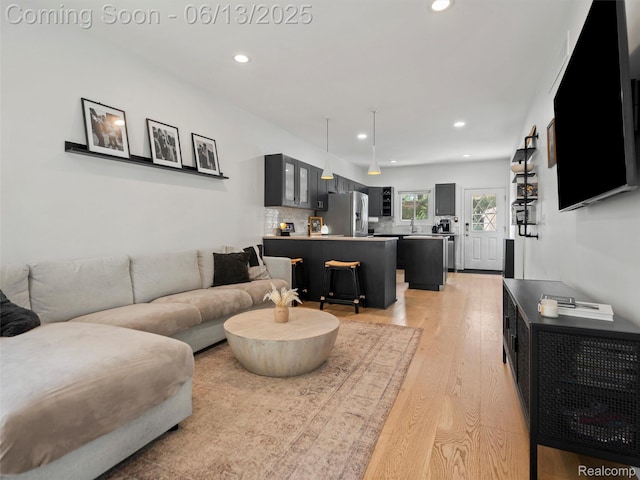 2147 Princeton Rd, Berkley, MI 48072 - living room featuring light wood finished floors and recessed lighting