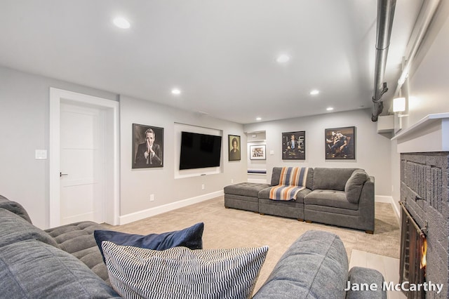 1101 Cadillac Dr SE, Grand Rapids, MI 49506 - living area with a lit fireplace, carpet floors, and recessed lighting