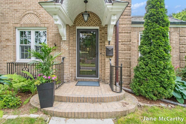 1101 Cadillac Dr SE, Grand Rapids, MI 49506 - doorway to property with brick siding