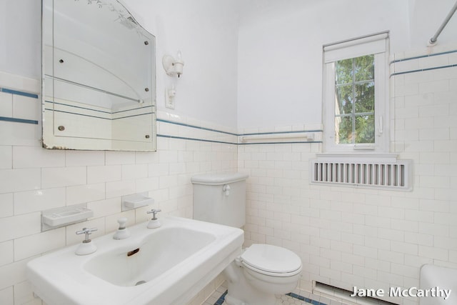 1101 Cadillac Dr SE, Grand Rapids, MI 49506 - bathroom with tile walls and toilet