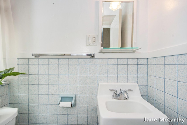 1101 Cadillac Dr SE, Grand Rapids, MI 49506 - half bathroom with toilet and tile walls