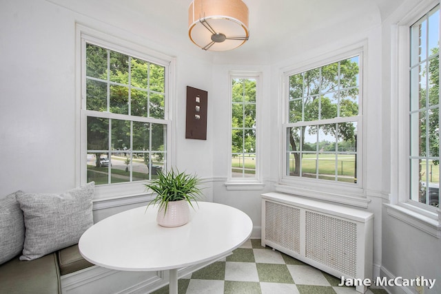 1101 Cadillac Dr SE, Grand Rapids, MI 49506 - sunroom featuring radiator heating unit
