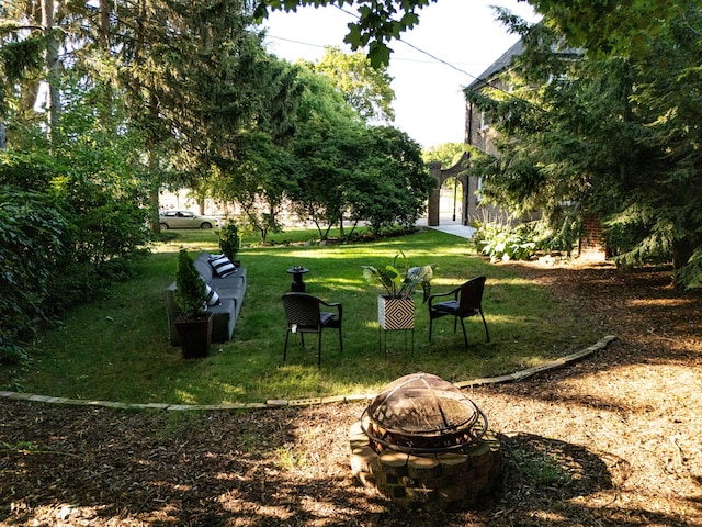1101 Cadillac Dr SE, Grand Rapids, MI 49506 - view of green lawn featuring a fire pit