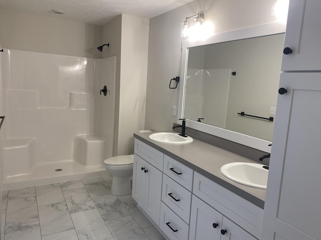 3353 Kings River St SW Unit 34, Wyoming, MI 49418 - bathroom featuring marble finish floors, double vanity, and a shower