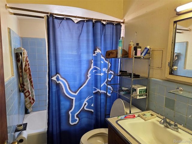 20200 Greeley St, Detroit, MI 48203 - full bathroom featuring vanity, shower / bath combo, decorative backsplash, and tile walls