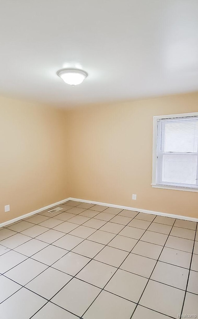15593 Thomas Ave, Allen Park, MI 48101 - unfurnished room featuring baseboards and light tile patterned floors