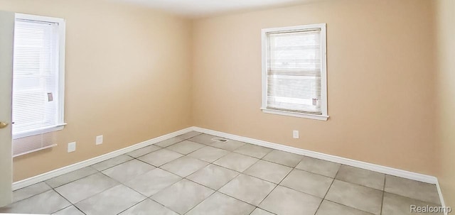 15593 Thomas Ave, Allen Park, MI 48101 - spare room with light tile patterned floors