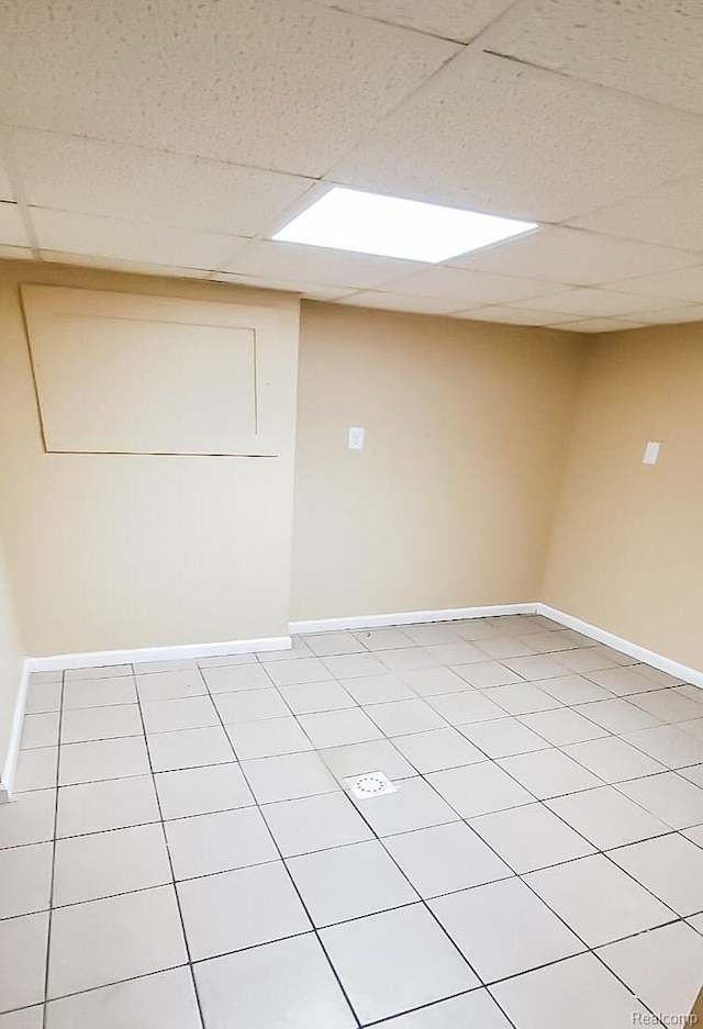15593 Thomas Ave, Allen Park, MI 48101 - spare room featuring a drop ceiling and light tile patterned flooring