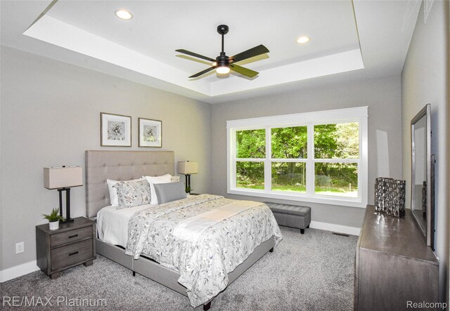 74 Candlelight, Brighton, MI 48114 - bedroom featuring a tray ceiling, carpet flooring, recessed lighting, and a ceiling fan