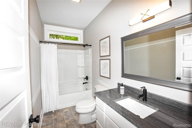 74 Candlelight, Brighton, MI 48114 - bathroom with vanity, stone finish floors, and shower / bath combo with shower curtain