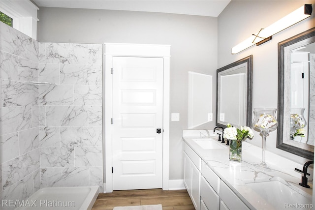 74 Candlelight, Brighton, MI 48114 - bathroom with double vanity and wood finished floors