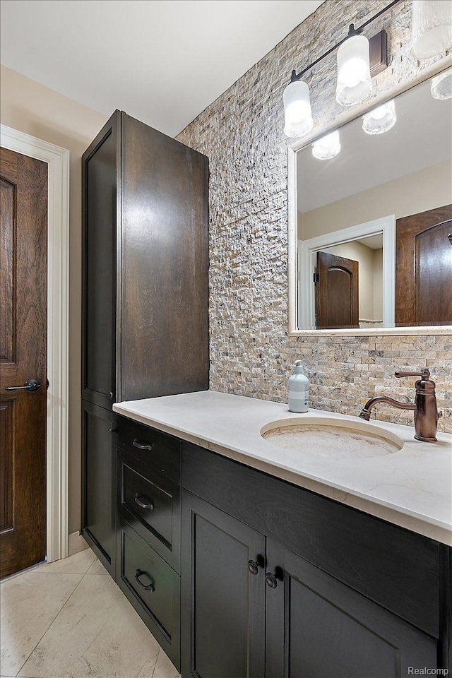 1330 Oxford Rd, Bloomfield Hills, MI 48304 - bathroom with vanity, tasteful backsplash, and tile patterned flooring