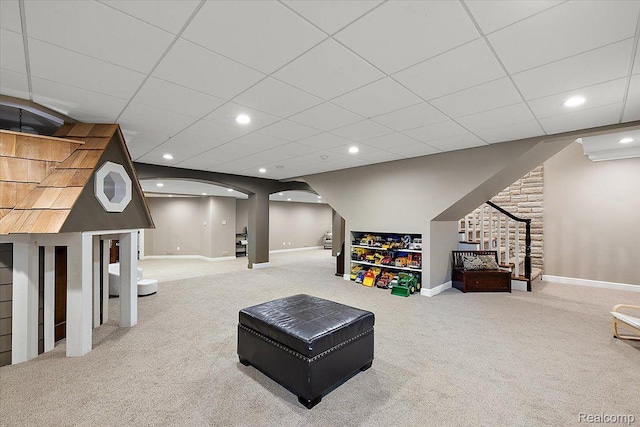 1330 Oxford Rd, Bloomfield Hills, MI 48304 - carpeted living room featuring stairs, arched walkways, recessed lighting, and a drop ceiling