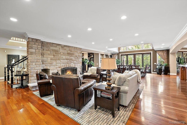 1330 Oxford Rd, Bloomfield Hills, MI 48304 - living room featuring crown molding, a fireplace, hardwood / wood-style floors, recessed lighting, and stairs