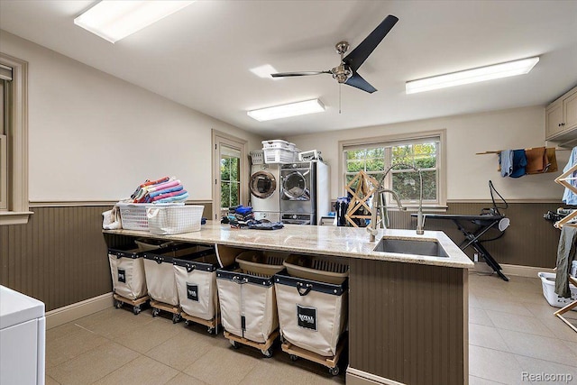 1330 Oxford Rd, Bloomfield Hills, MI 48304 - kitchen with a wainscoted wall, ceiling fan, light stone countertops, light tile patterned floors, and wooden walls