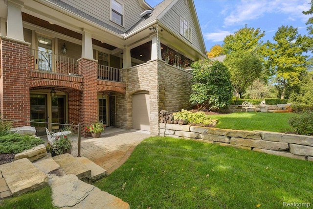 1330 Oxford Rd, Bloomfield Hills, MI 48304 - view of side of property with brick siding, a yard, a balcony, and stone siding