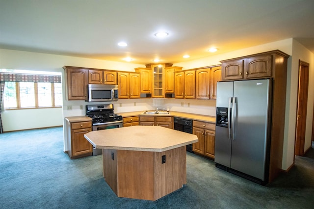 13123 N Jennings Rd, Clio, MI 48420 - kitchen with appliances with stainless steel finishes, light countertops, dark carpet, a kitchen island, and recessed lighting