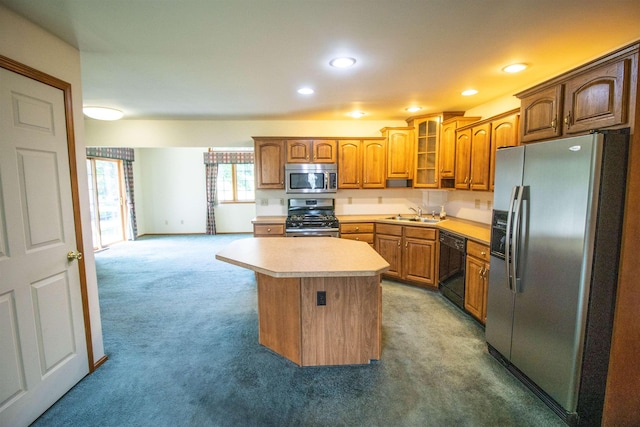 13123 N Jennings Rd, Clio, MI 48420 - kitchen featuring stainless steel appliances, light colored carpet, light countertops, a center island, and recessed lighting