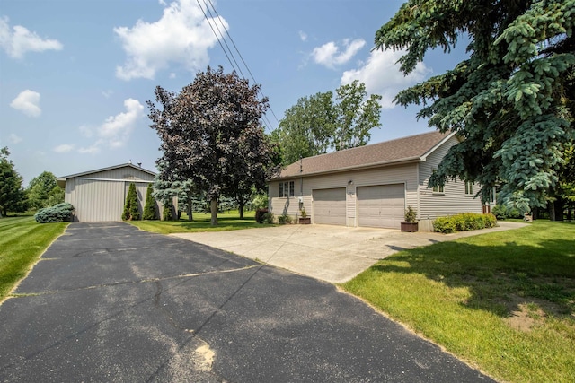 13123 N Jennings Rd, Clio, MI 48420 - ranch-style home with a front lawn, driveway, and an attached garage