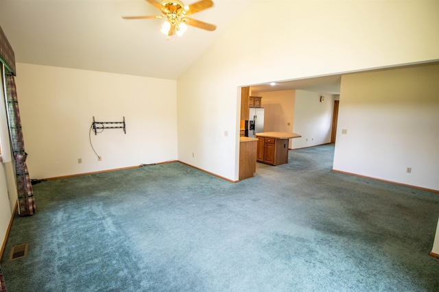 13123 N Jennings Rd, Clio, MI 48420 - unfurnished living room featuring ceiling fan, light colored carpet, and high vaulted ceiling