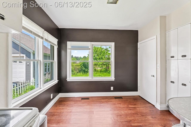 1226 W Genesee St, Lapeer, MI 48446 - unfurnished bedroom with wood finished floors and a closet