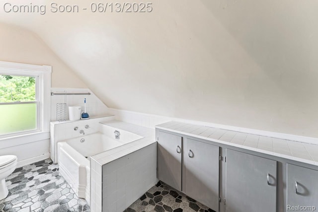 1226 W Genesee St, Lapeer, MI 48446 - bathroom featuring lofted ceiling and a bath