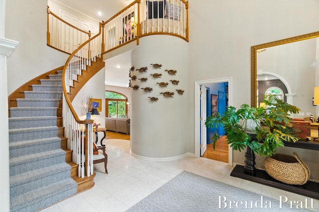 5691 Forest Gln SE, Ada, MI 49301 - tiled entrance foyer featuring a towering ceiling and stairway