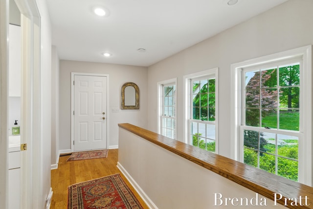5691 Forest Gln SE, Ada, MI 49301 - hall with light wood-style flooring and recessed lighting