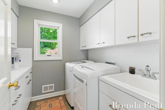 5691 Forest Gln SE, Ada, MI 49301 - washroom featuring cabinet space, washing machine and dryer, and recessed lighting