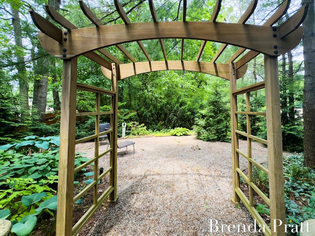 5691 Forest Gln SE, Ada, MI 49301 - view of patio featuring a pergola