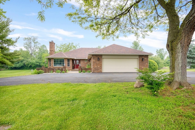 9128 Clover Dr, Milan, MI 48160 - ranch-style house featuring driveway, a chimney, an attached garage, a front yard, and brick siding