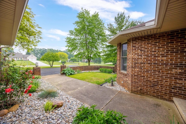 9128 Clover Dr, Milan, MI 48160 - view of grassy yard featuring a patio area