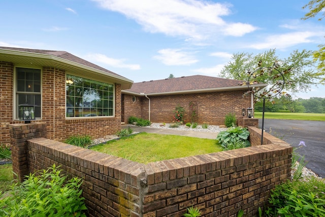 9128 Clover Dr, Milan, MI 48160 - view of front of property featuring brick siding and a shingled roof