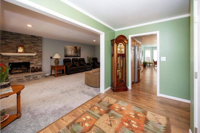 9128 Clover Dr, Milan, MI 48160 - living area with ornamental molding, wood finished floors, and a fireplace