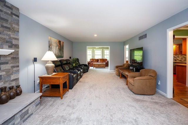 9128 Clover Dr, Milan, MI 48160 - carpeted living area featuring a fireplace and baseboards