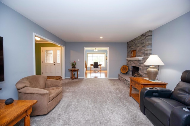 9128 Clover Dr, Milan, MI 48160 - living area featuring carpet floors, a stone fireplace, and recessed lighting