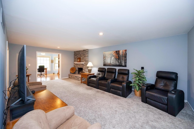 9128 Clover Dr, Milan, MI 48160 - carpeted living area with a stone fireplace and recessed lighting