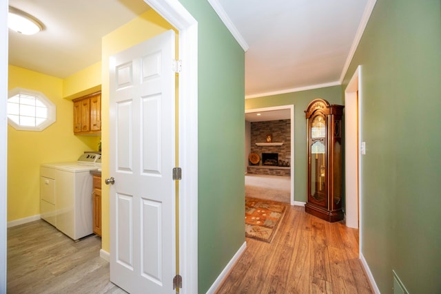 9128 Clover Dr, Milan, MI 48160 - corridor featuring light wood finished floors, crown molding, and washing machine and dryer