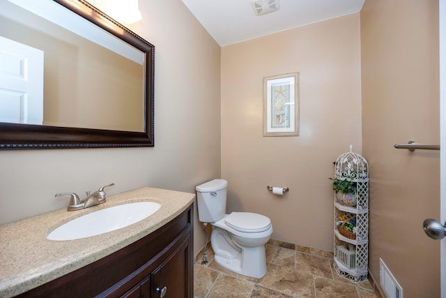 9128 Clover Dr, Milan, MI 48160 - half bath featuring vanity and stone finish flooring
