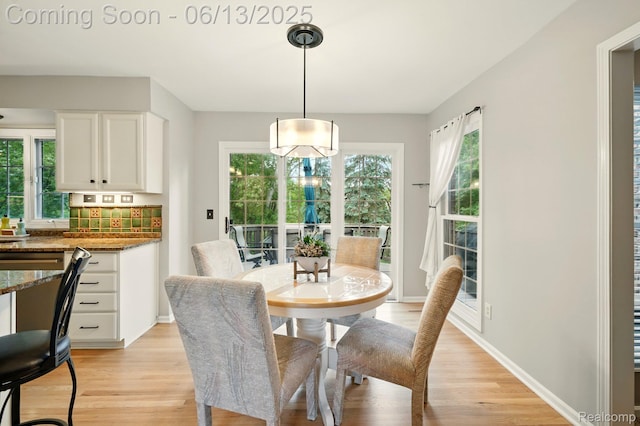 1377 Lake Shore Blvd, Lake Orion, MI 48362 - dining space with light wood-style floors and baseboards