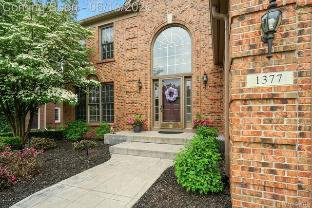 1377 Lake Shore Blvd, Lake Orion, MI 48362 - doorway to property with brick siding