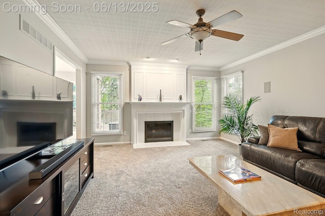 1377 Lake Shore Blvd, Lake Orion, MI 48362 - carpeted living area with a fireplace, a ceiling fan, and ornamental molding