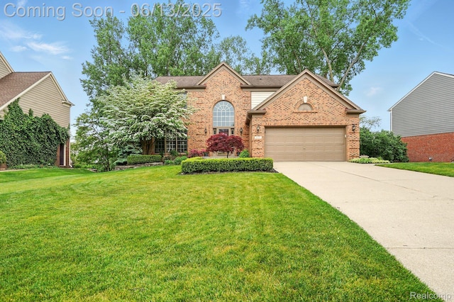 1377 Lake Shore Blvd, Lake Orion, MI 48362 - view of front facade with brick siding, driveway, a front yard, and an attached garage