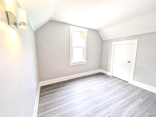 3639 Farnsworth St, Detroit, MI 48211 - additional living space featuring wood finished floors and vaulted ceiling