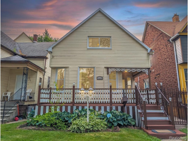 3639 Farnsworth St, Detroit, MI 48211 - back of house at dusk with a porch